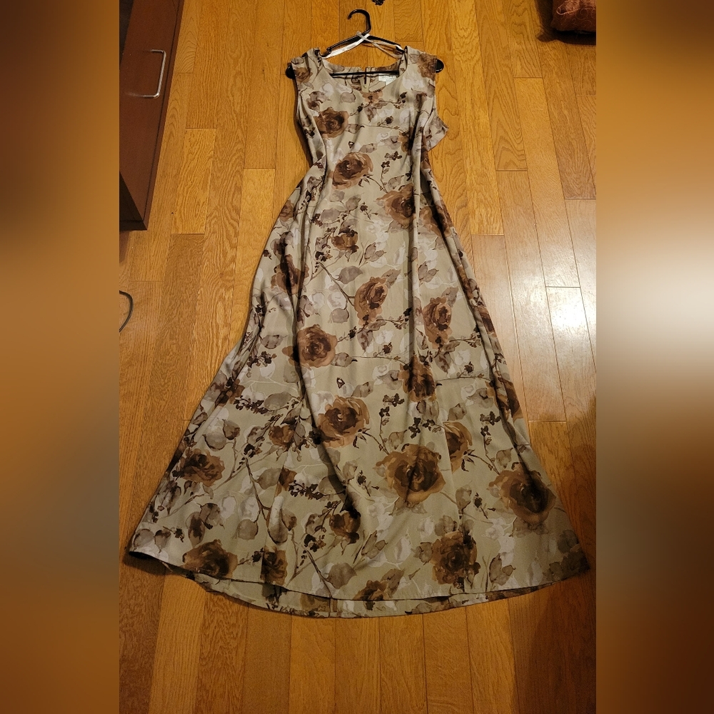 Norton McNaughton brown dress adorned with flowers.